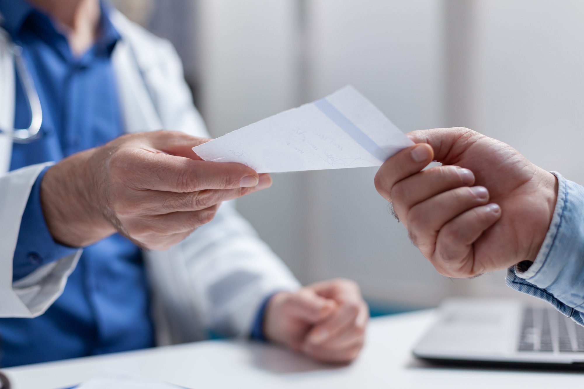 close-up-doctor-giving-prescription-paper-patient-checkup-appointment-physician-handing-out-document-treatment-medicine-against-disease-people-meeting-consultation