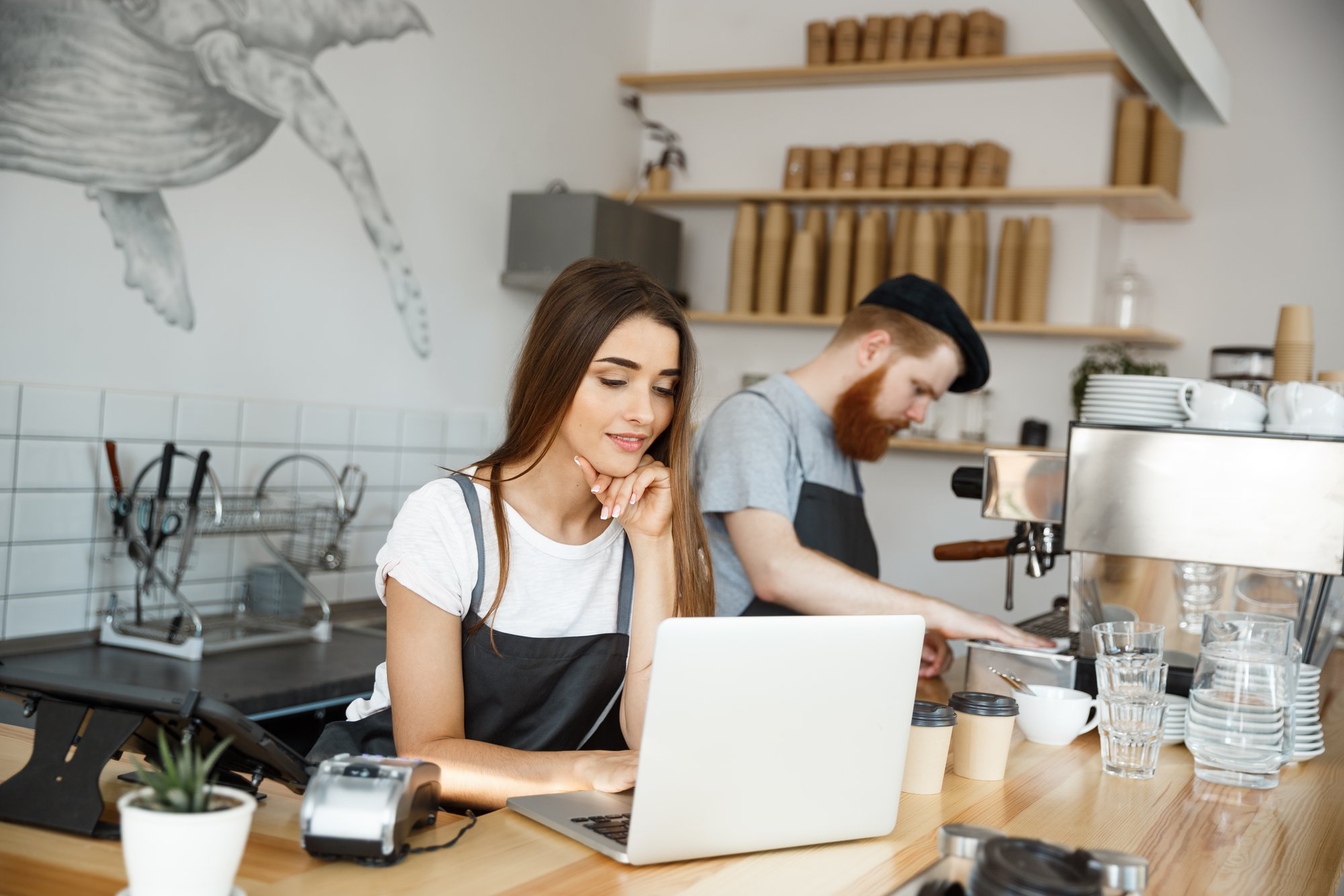 young-woman-using-laptop-table